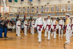 group of uniformed cadets gathered for an academic ceremony