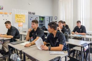 students attentively seated at desks in a classroom