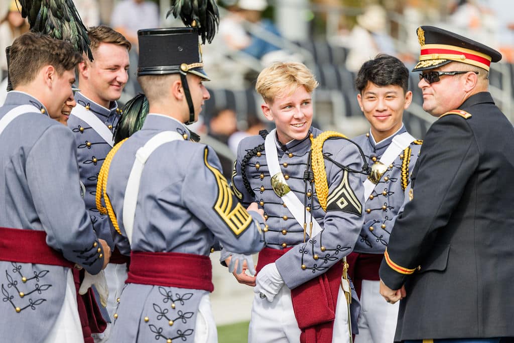 cadets in uniform engaged in conversation