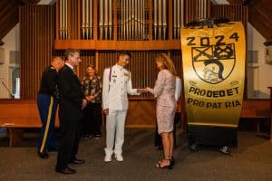 A cadet receives a ring during a formal ceremony