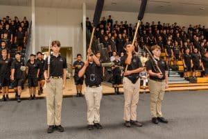 students line up in a ceremony